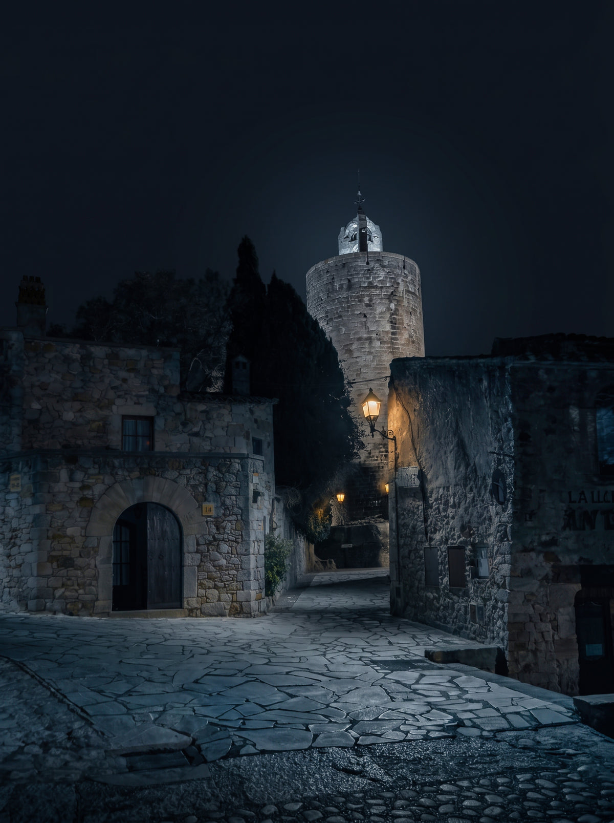 Keeper of Hours — night photograph of the Torre de les Hores in Pals, Girona, under a starry sky. Limited edition fine art print by Marco Zouvek.